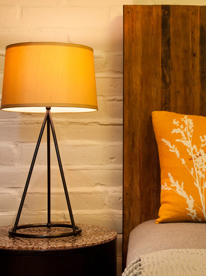 Close up view of bedside lamp Fireside Lodge room with king size bed.